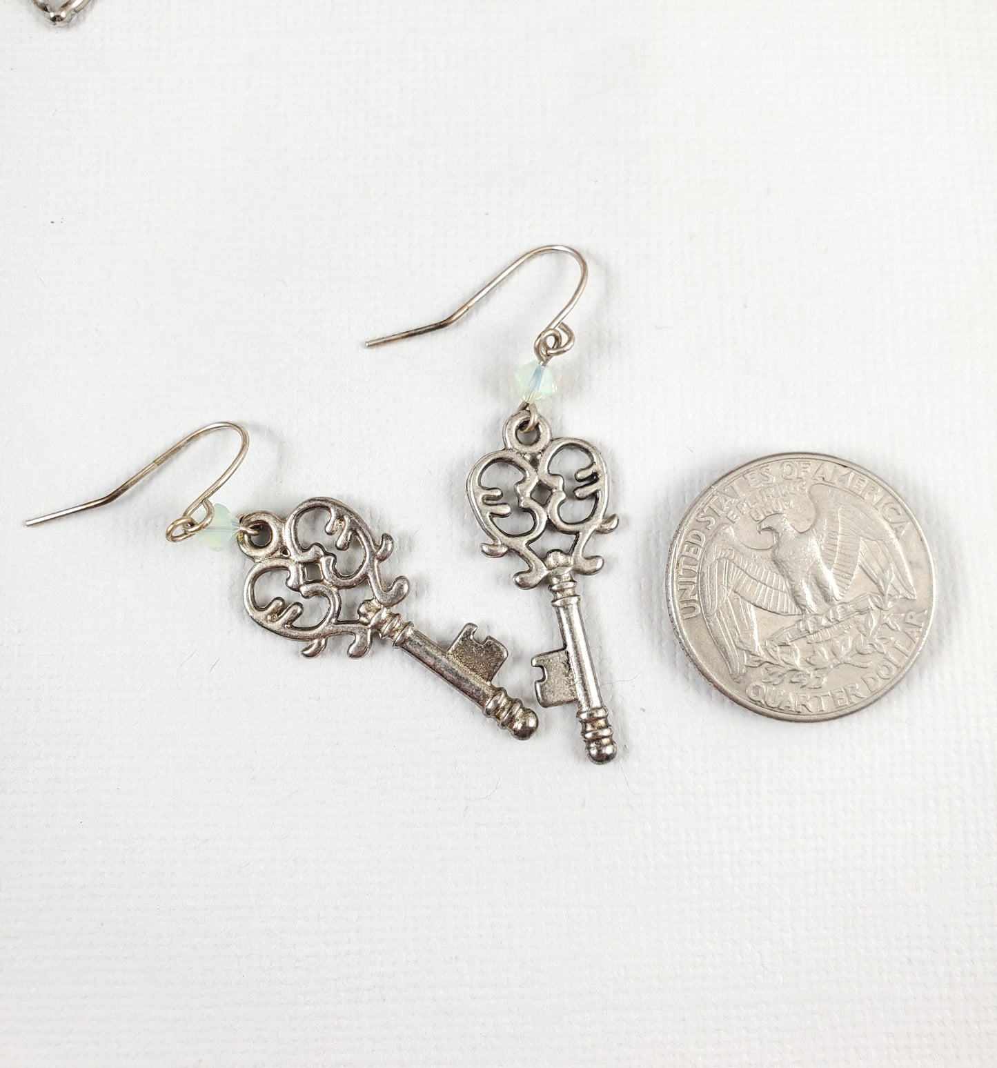 Silver Openwork Key Earrings with Chrysolite Opal Green Crystals