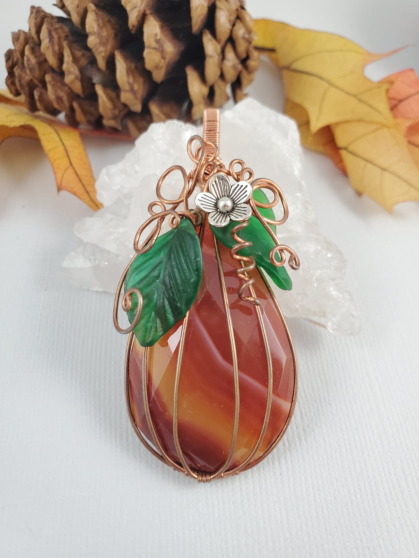 Faceted Carnelian Teardrop Pumpkin Pendant with Silver Flower