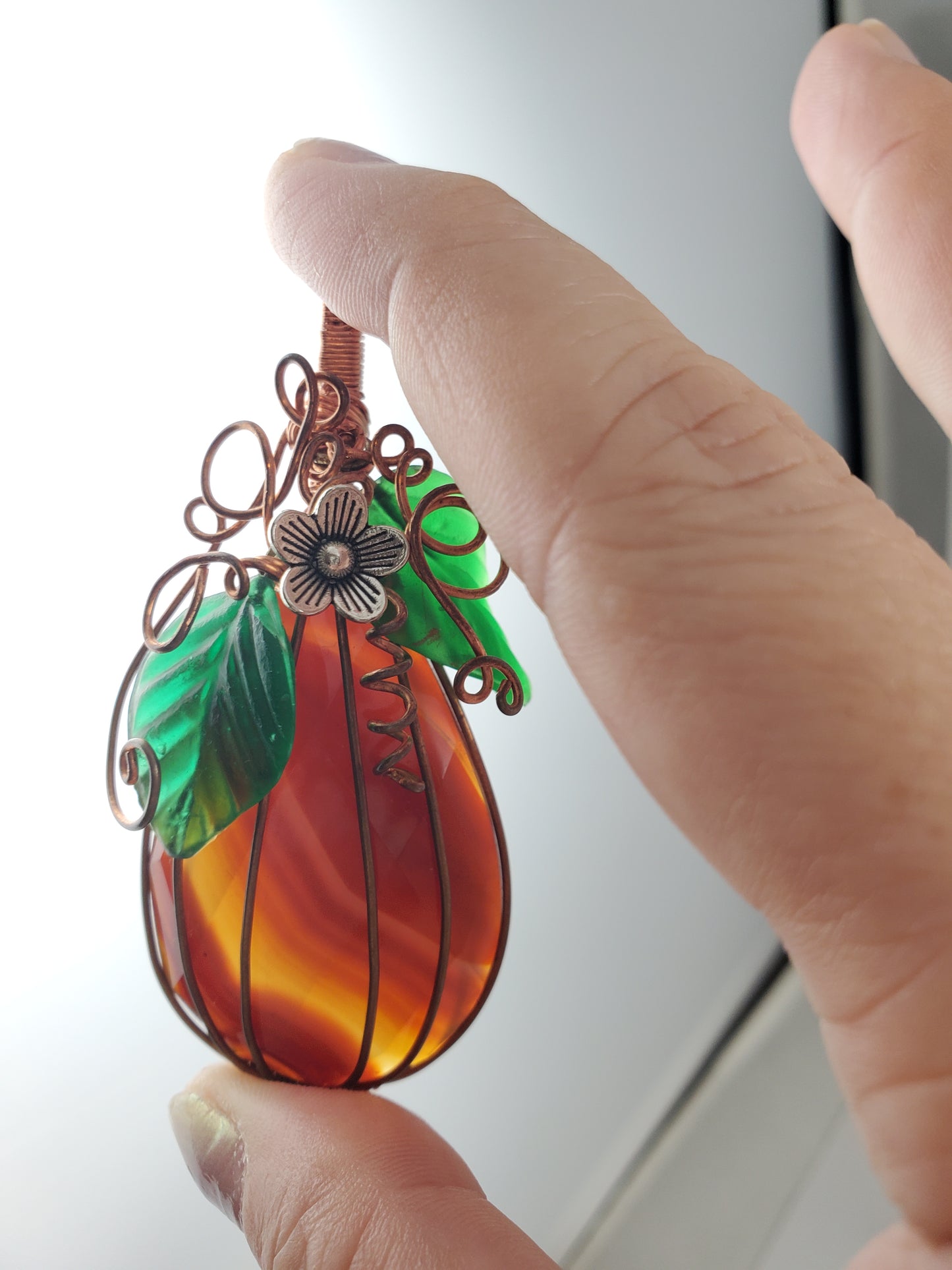 Faceted Carnelian Teardrop Pumpkin Pendant with Silver Flower