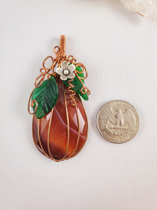 Faceted Carnelian Teardrop Pumpkin Pendant with Silver Flower
