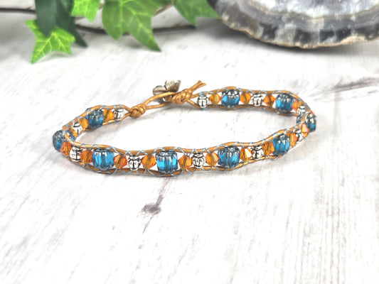 Blue, Orange, and Silver Leather Bracelet with Flower Button Closure